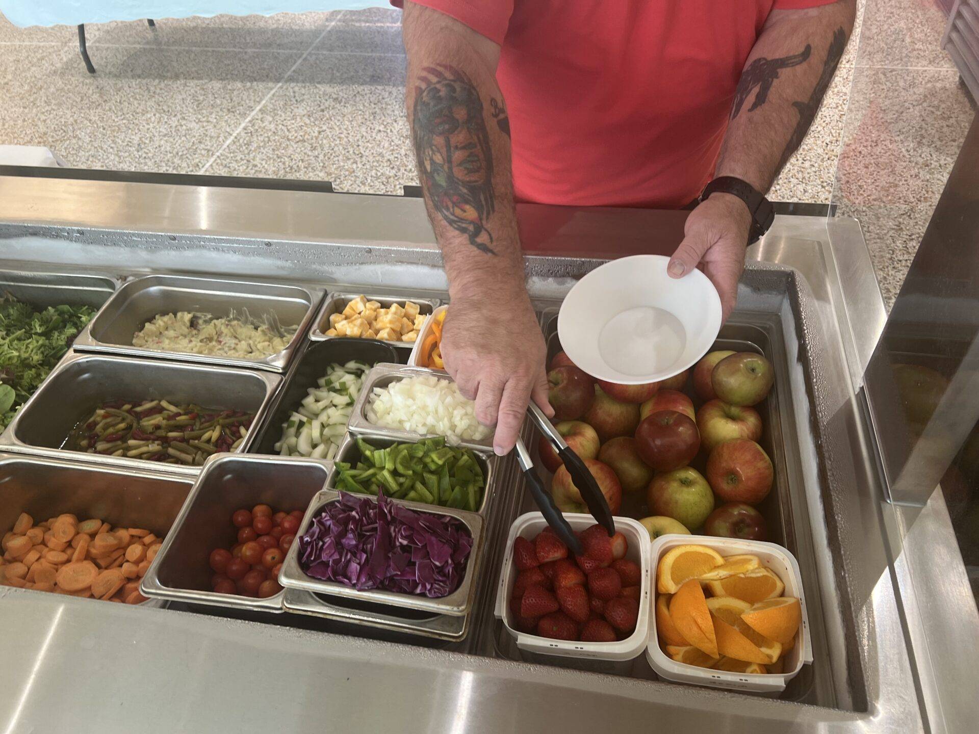 Man getting food at a buffet